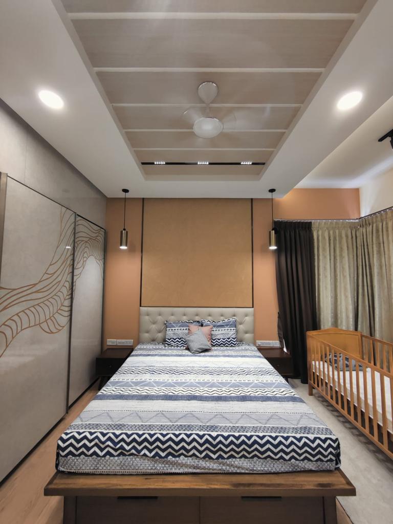 Master bedroom with tufted headboard and pendant lights