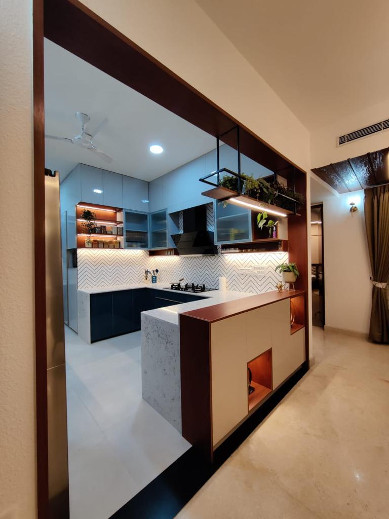 Kitchen with island counter and wooden ceiling accents