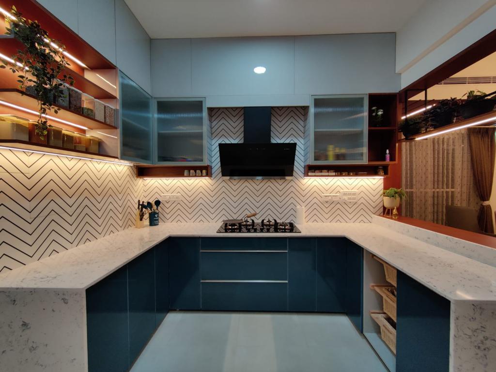 U-shaped modular kitchen with chevron backsplash and marble countertops