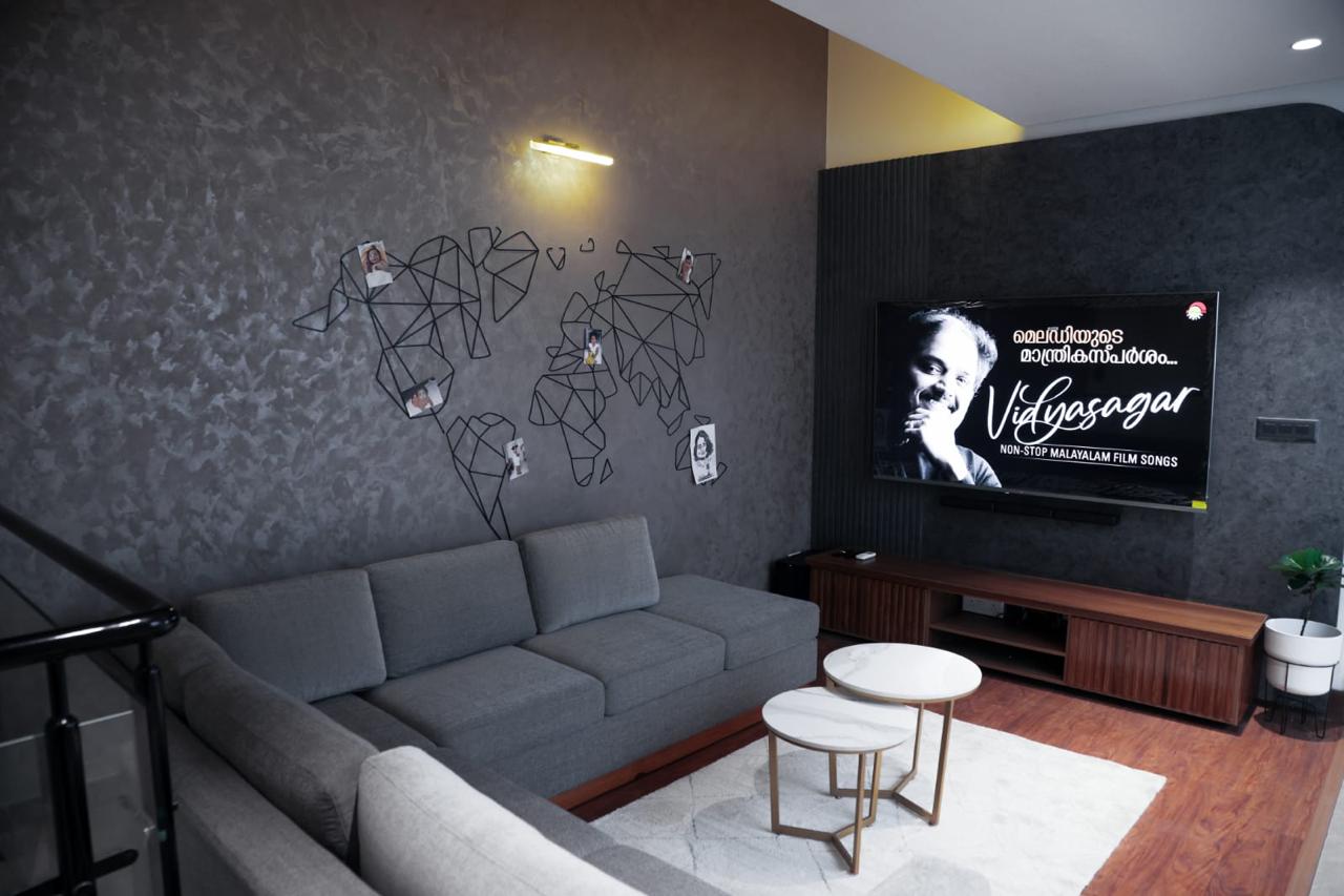 Entertainment lounge with textured accent wall and TV unit